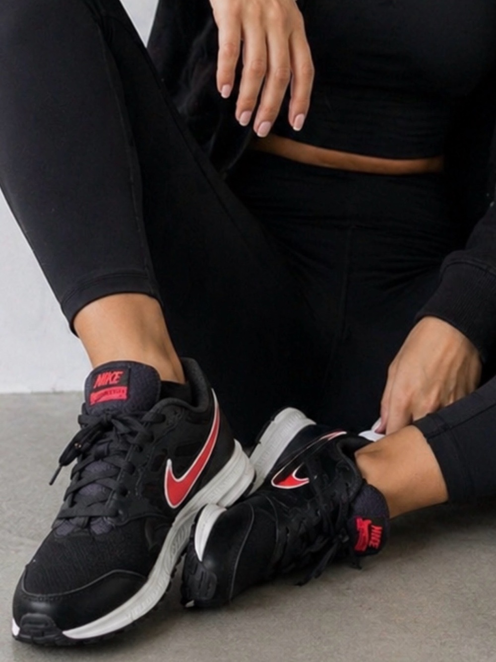 Nike Women's Black Sneakers with Red Swoosh
